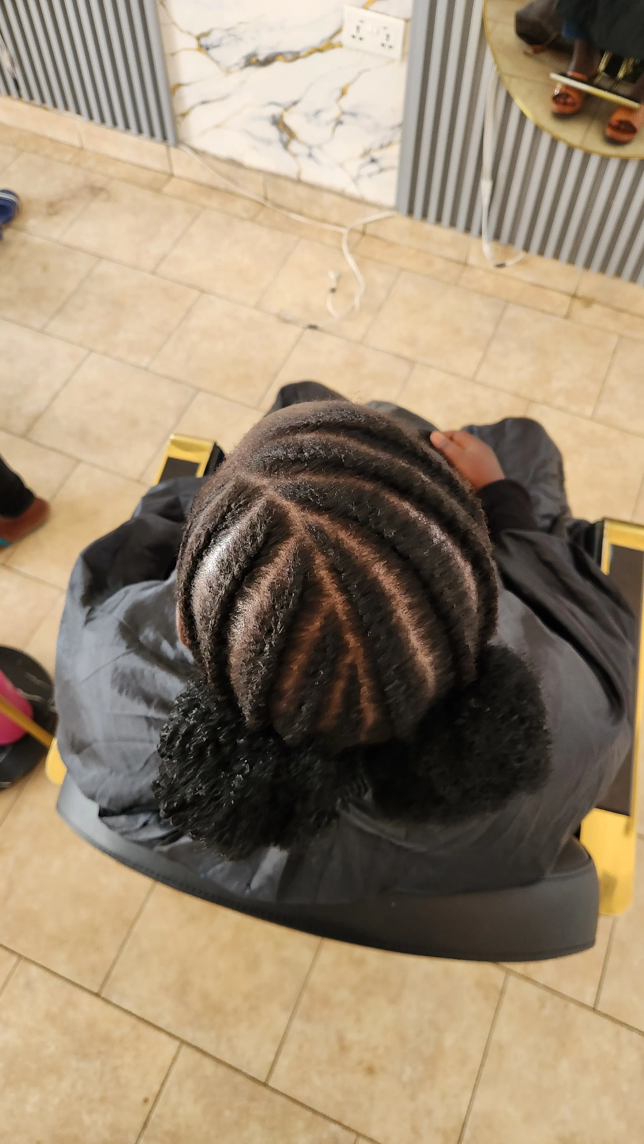 Soft curled hairstyle finished in the salon by Ash Hair Story.
